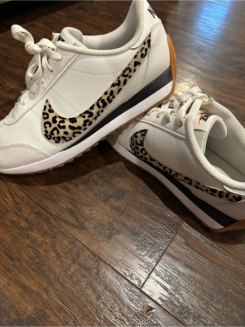 Nike Women's White Sneakers with Leopard Swoosh Accent